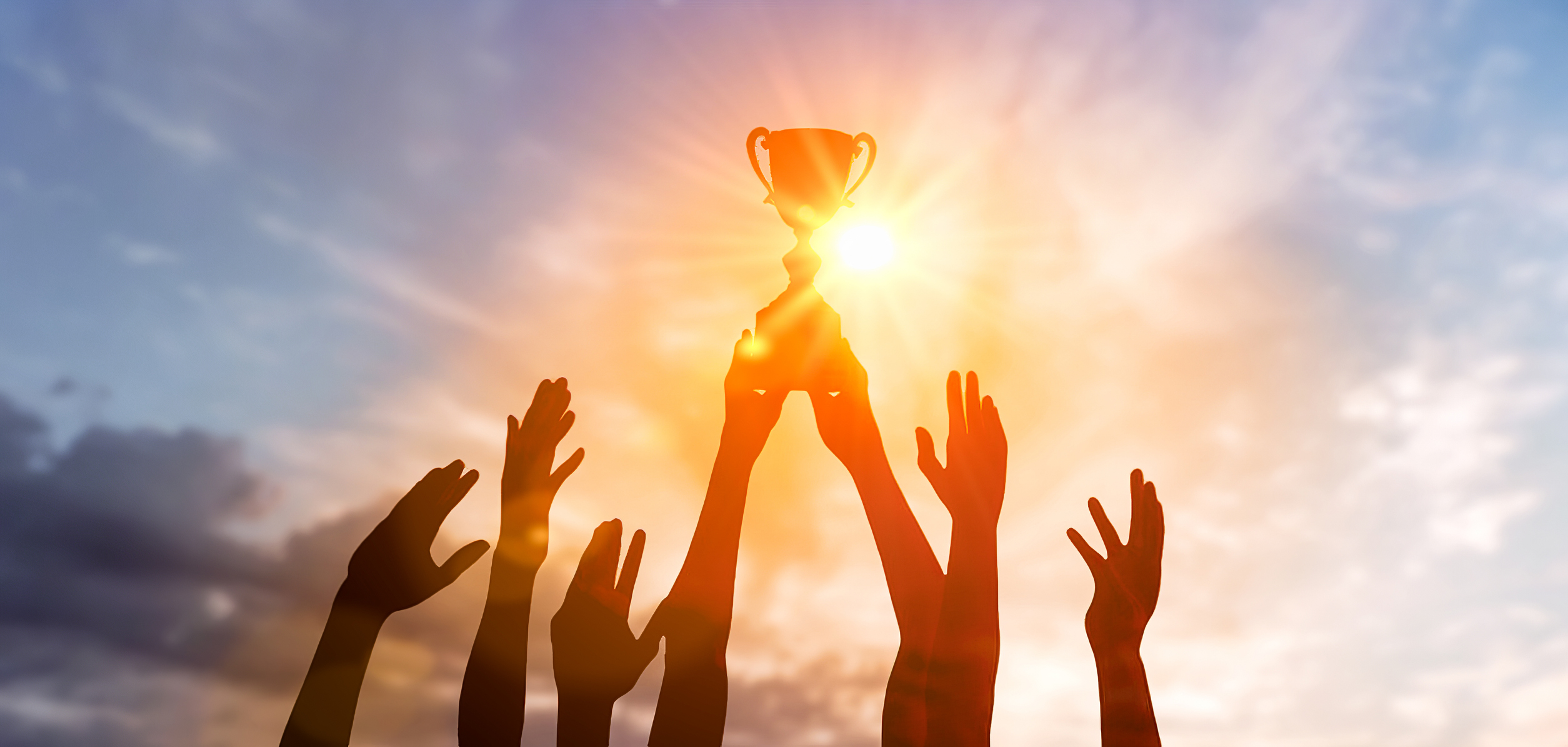 Silhouette Business team holding award trophy